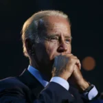 Former U.S. President Joe Biden speaking during a public appearance, with a serious and reflective expression, as reports highlight his ongoing battle with metastatic prostate cancer.
